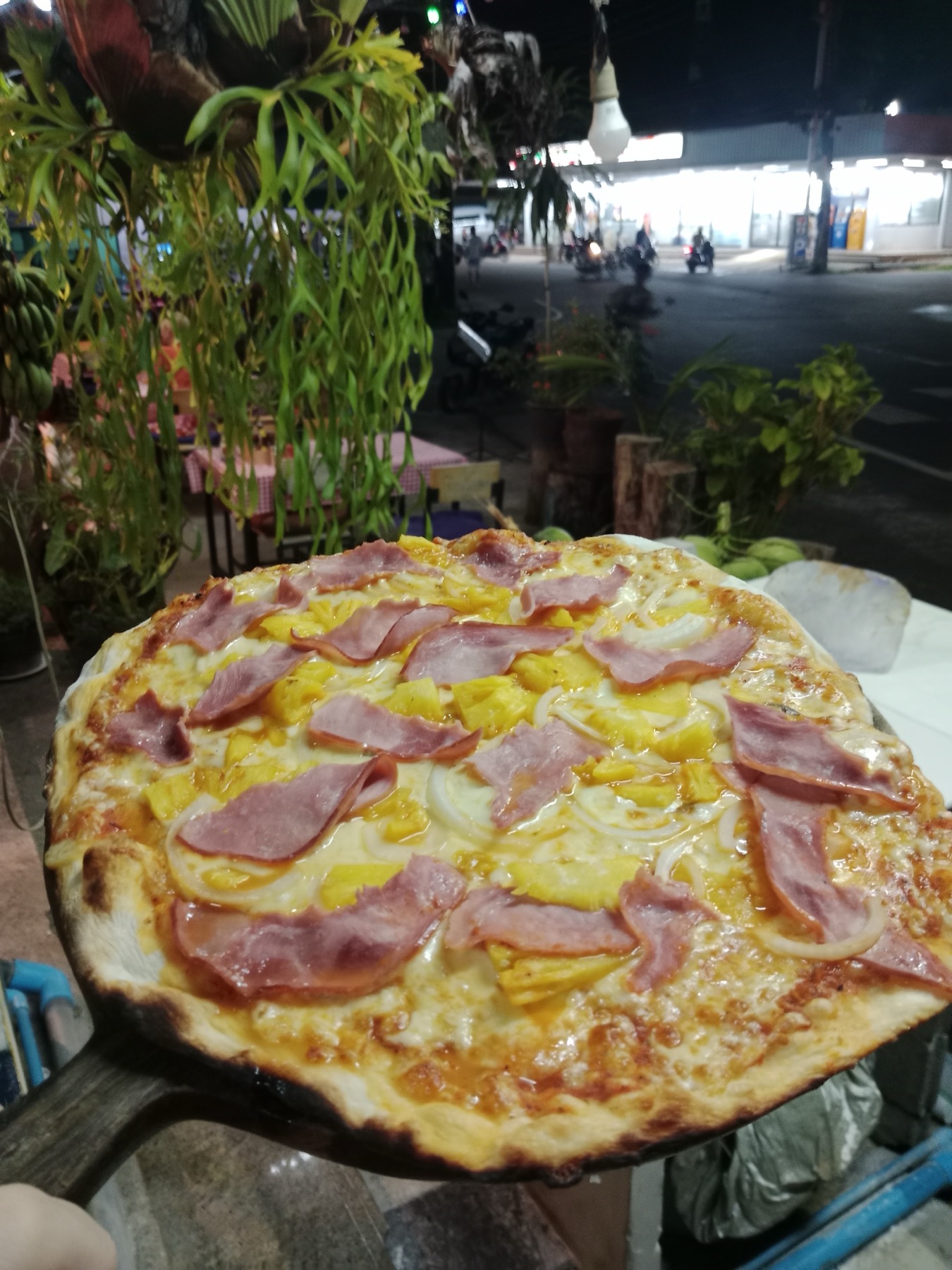 Ham and pineapple pizza ready to serve