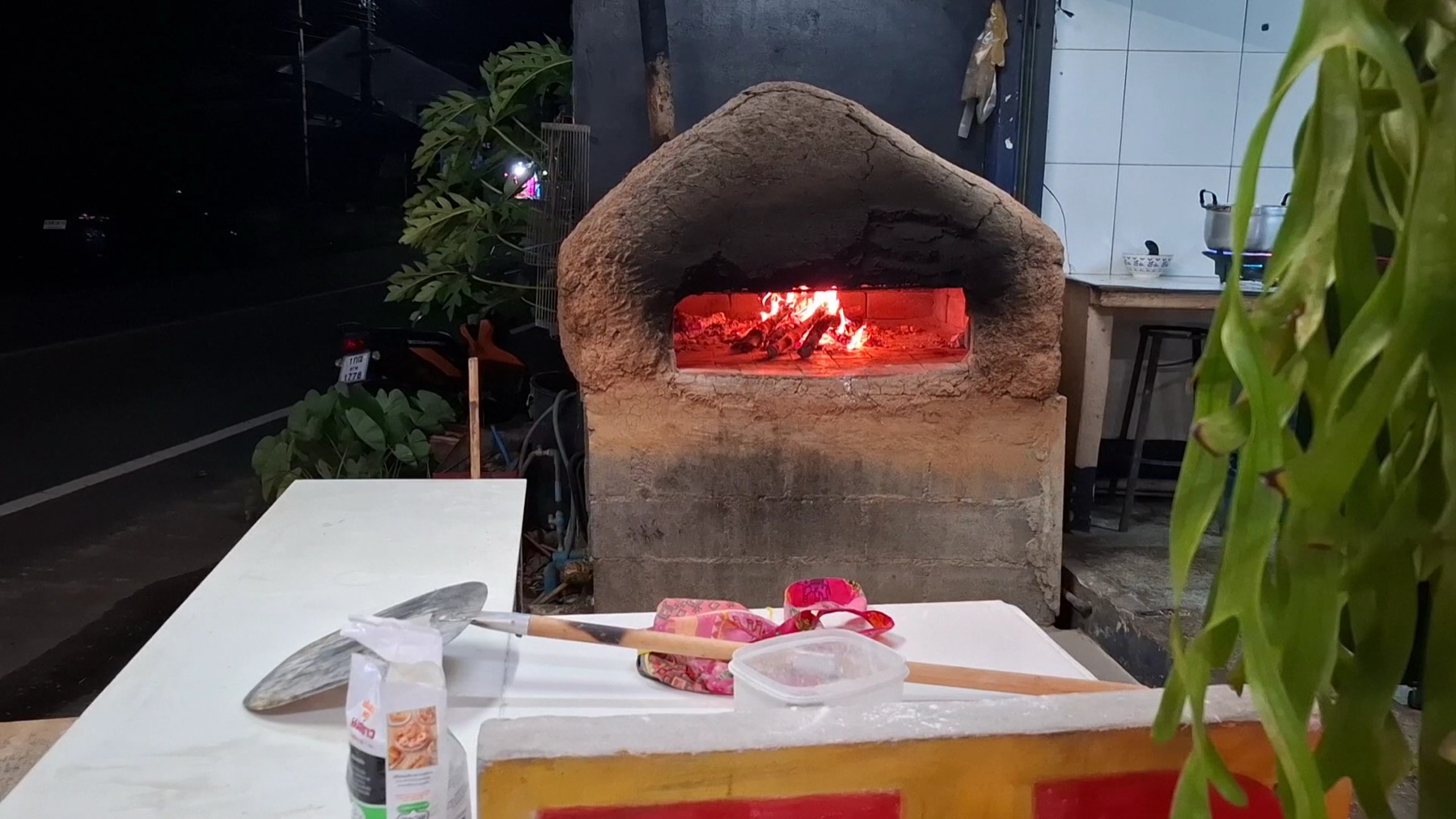 The fire burning inside Casa Mia’s wood-fired oven